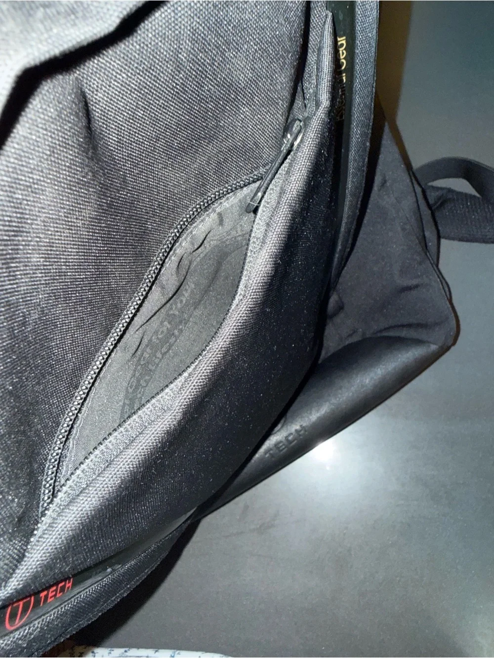 Tumi Black Tech Backpack with Subtle Red Accent